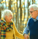 Couple in their 80s on a walk in autumn