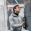 male customer choosing large fridges in domestic appliances section