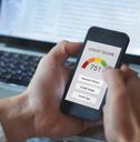 man holding smartphone showing credit score
