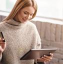 A woman shopping online with a credit card