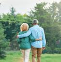 senior couple walking in outdoor park