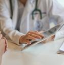 doctor showing patient some information