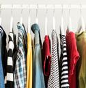 Collection of clothes hanging on rack