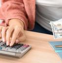 woman counting money at home