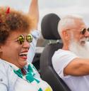 Happy senior couple having fun during road trip travel vacation
