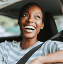 Smiling woman driving a car