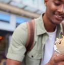 Man Eating Burrito At Outdoor Street Food Stall
