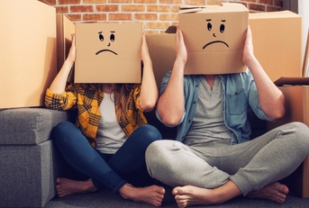 unhappy couple moving