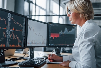 Hedge fund investor looking at computer