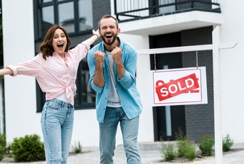 Happy couple that just bought a house