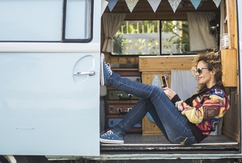 Woman sitting in van