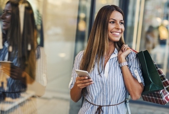 Woman shopping with phone in hand