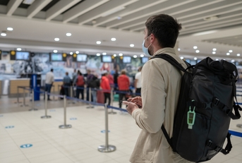 Man at airport in customer service area