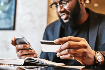 man with credit card and phone