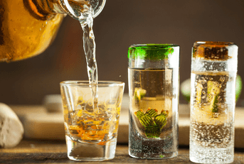 Tequila shots being poured 