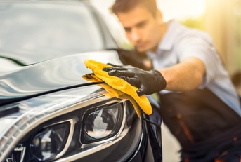 Man detailing car