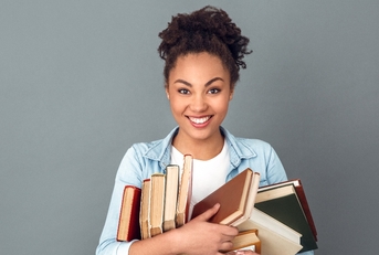 Young African-American woman holding books