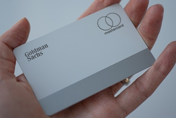woman holding apple credit card