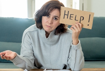 upset young woman asking for help in paying bills