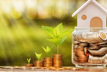 Stack of coins with model house