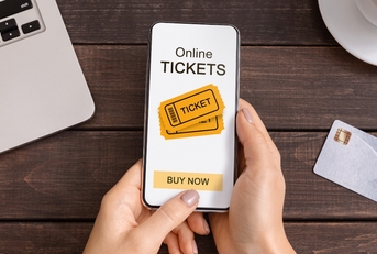 Someone buying tickets on their phone