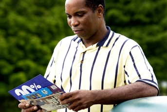 man getting mail from mailbox