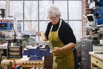 Art Jeweler Working in Studio