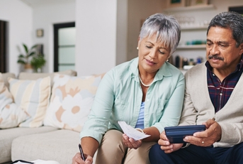 elderly couple working out a budget
