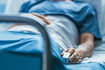 in the hospital sick male patient sleeps on the bed