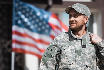 Smiling military veteran in camouflage