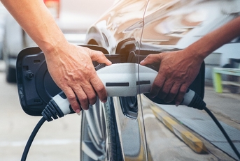 charging modern electric car battery on the street