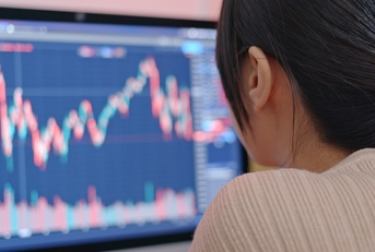 adult woman reviewing stock market performance