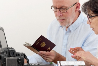 Senior couple preparing vacation trip with passport