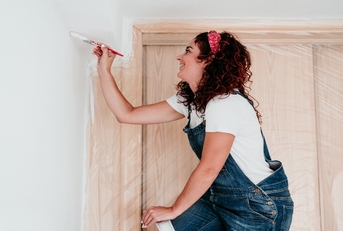 woman painting home improvement