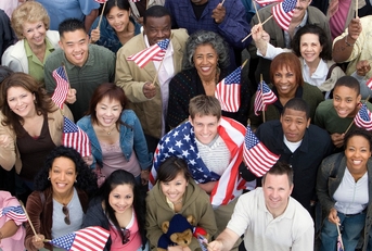 High angle view of people raising American flags