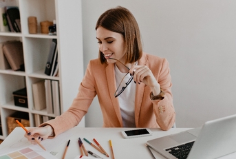 lady with smile looks at documents 