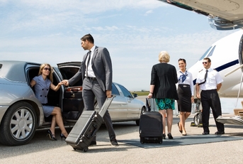 business partners about to board private jet