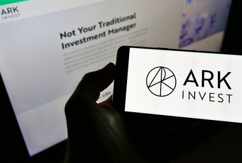 Ark Invest on the phone screen and background computer screen