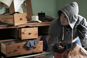 burglar stealing Items from bedroom