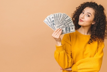 young woman holding money banknotes 