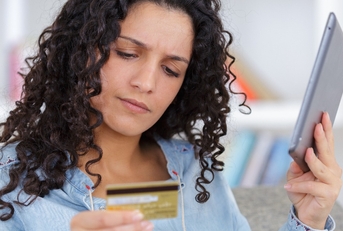 worried shopper buying online with credit card