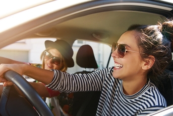  young women driving in a car