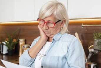 woman financially stressed and pressured by mortgage debt