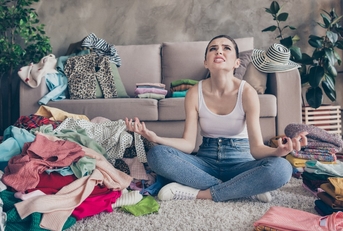 annoyed woman discover many dirty dressing clothes