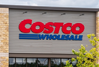 costco wholesale sign board outside store during day time