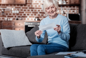 joyful pensioner keeping smile