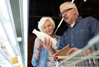senior couple choosing milk