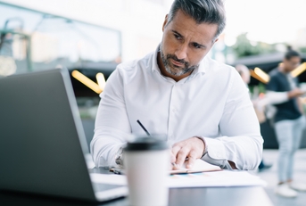 businessman using laptop computer for informative research