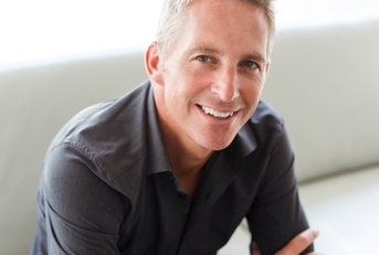 portrait of single 40s man sitting in sofa