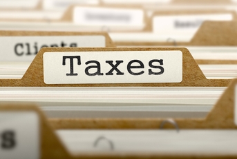 taxes concept with word on folder